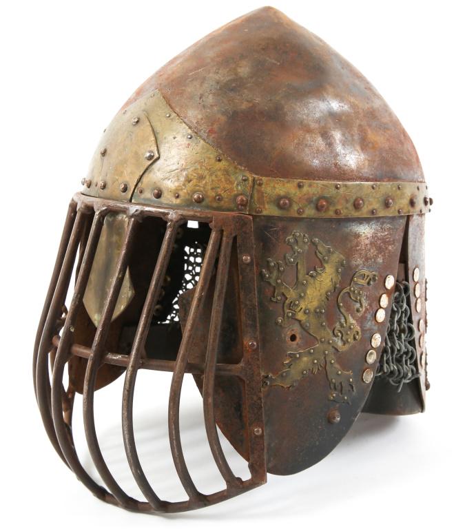 EUROPEAN STEEL & BRASS MARKED HELMET: EUROPEAN STEEL & BRASS MARKED HELMET Victorian era production, theater or display helmet. Marked with four brass rampant lions, brass top band. Steel skull & lower flaps. Multi-bar facial guard. Small