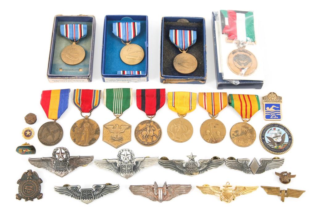 US WWII TO DESERT STORM WORLD MEDALS LOT: US WWII TO DESERT STORM WORLD MEDALS LOT Lot includes: Texas National guard medal, Kuwait Liberation medal set, USSR Naval swimmers medal, Vietnam service medal, Marked USAAF wings, USAAF Gunner Wings