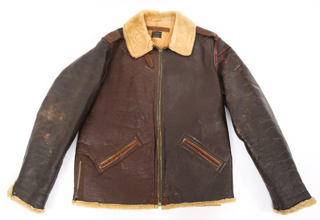 WWII USAAF TYPE B-6 AVIATOR FLIGHT JACKET: WWII USAAF TYPE B-6 AVIATOR FLIGHT JACKET WWII USAAF Type B-6 Aviator's sheepskin brown leather sheep fur / fleece lined bomber style jacket. Above tag is the brown leather hanging loop. Size: 42 per 