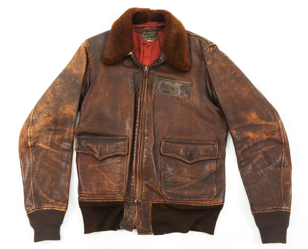 WWII US NAVY PILOT M422 G-1 PILOT'S FLIGHT JACKET: WWII US NAVY PILOT M422 G-1 PILOT'S FLIGHT JACKET WWII USAAF Type A-2 Army Air Forces Pilot's goatskin leather flight jacket. Brown fur collar. Leather hanging loop over tag. Red silk interior lining.