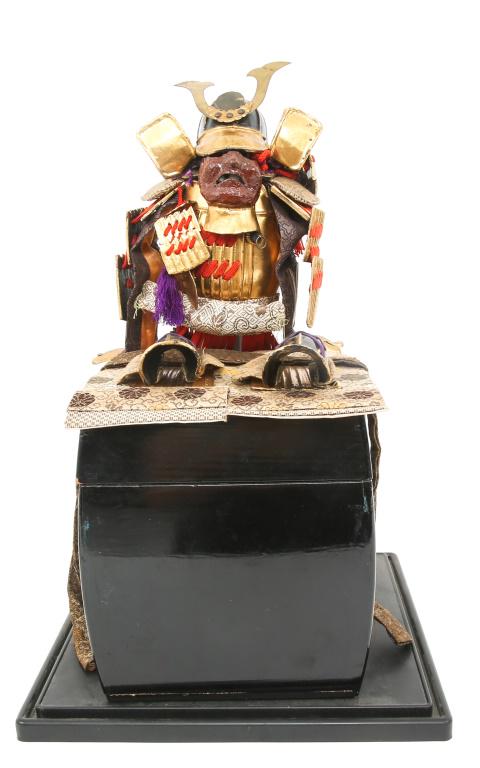 JAPANESE MINIATURE SAMURAI ARMOR SET BOXED: JAPANESE MINIATURE SAMURAI ARMOR SET BOXED Complete Japanese miniature samurai armor set. Lacquered wood box below display samurai armor set measuring 8" by 8" by 8". Miniature armor set is decorated 
