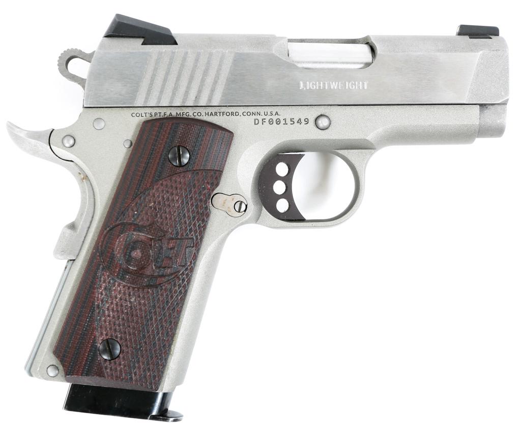 COLT DEFENDER LIGHTWEIGHT .45 ACP PISTOL: COLT DEFENDER LIGHTWEIGHT .45 ACP PISTOL Colt Defender Lightweight .45 ACP semi-automatic pistol. Checkered dark rosewood Colt grips, stainless and gray parkerized slide and frame. Lightweight hammer 