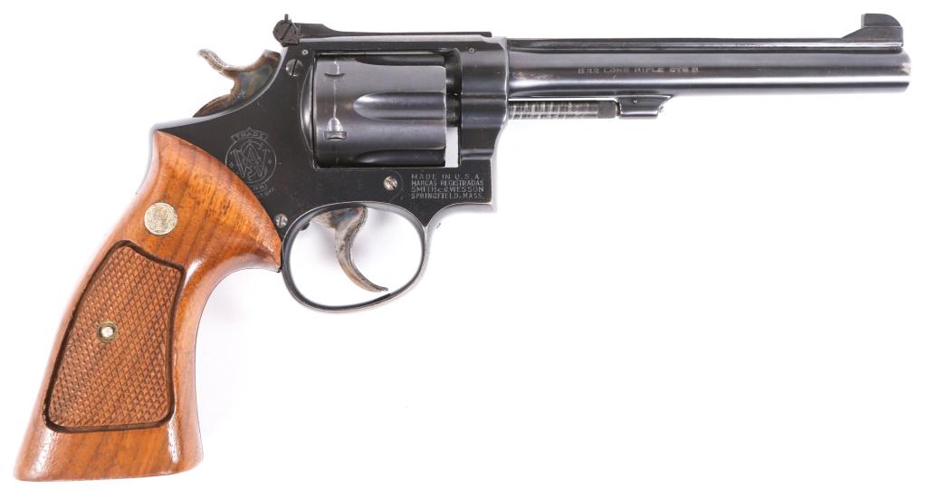 SMITH & WESSON MODEL 17-3 .22 LR REVOLVER: SMITH & WESSON MODEL 17-3 .22 LR REVOLVER Smith and Wesson Model 17-3 .22LR Revolver. The revolver features checkered walnut target grips, blued finish, adjustable rear sights, six shot cylinder and h