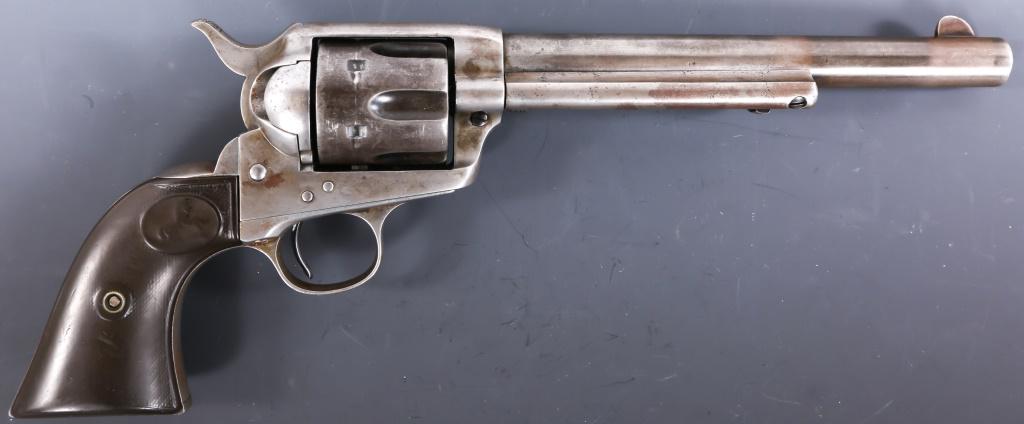 1900 COLT FRONTIER SIX SHOOTER .44-40 WIN REVOLVER: 1900 COLT FRONTIER SIX SHOOTER .44-40 WIN REVOLVER 1900 Colt Frontier Six Shooter .44-40 Win revolver. Revolver features light gray mottled patina, and brown checkered Colt hard rubber grips. Barrel r