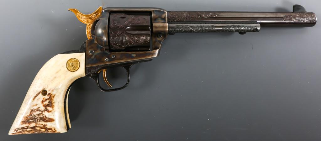 1977 COLT M1873 N.C. FOSTER ENGRAVED REVOLVER: 1977 COLT M1873 N.C. FOSTER ENGRAVED REVOLVER 1977 Colt model 1873 Single Action Army N.C. Foster Engraved .45 Colt revolver, in wooden display case. Revolver features blued finish, stag grips with Co