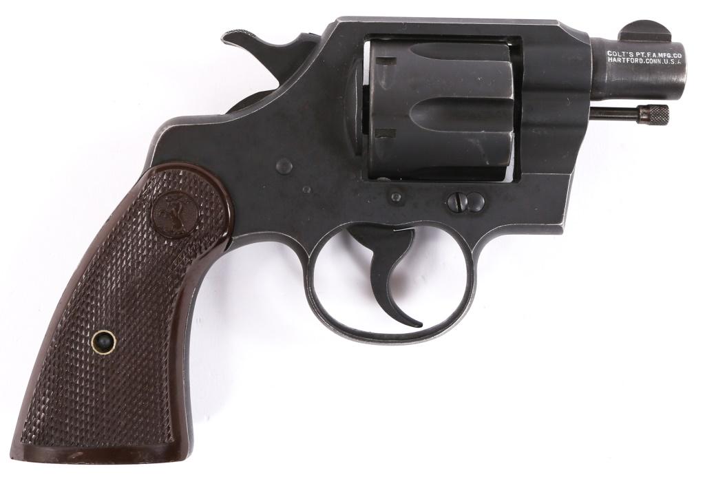 1942 WWII US COLT COMMANDO .38 SPL 2" REVOLVER: 1942 WWII US COLT COMMANDO .38 SPL 2" REVOLVER 1942 WWII US Colt Commando .38 Special revolver. Revolver features 2" barrel, parkerized finish, brown checkered hard rubber grips, and matching serial n