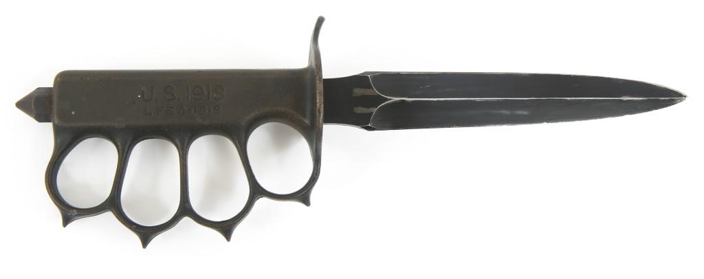 WWI US ARMY M1918 LF&C TRENCH KNIFE WITH SCABBARD: WWI US ARMY M1918 LF&C TRENCH KNIFE WITH SCABBARD WWI US Army AEF M1918 trench knife with steel scabbard. Brass knuckle guard, double side edge blued blade. Name " Tony " hand engraved on the back of 