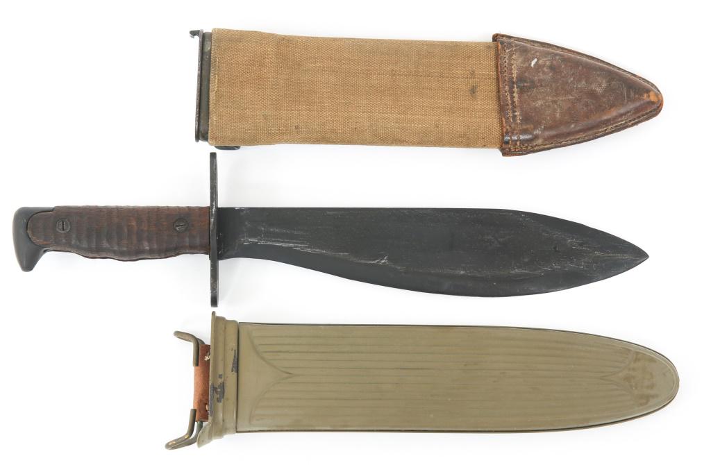 WWI MODEL 1917 US BOLO KNIFE WITH TWO SCABBARDS: WWI MODEL 1917 US BOLO KNIFE WITH TWO SCABBARDS WWI Model 1917 US Bolo Knife with Two Scabbards. Matte black blade, ricasso marked "US MOD. 1917 & PLUMB PHILA 1918". One metal painted steel scabbard m
