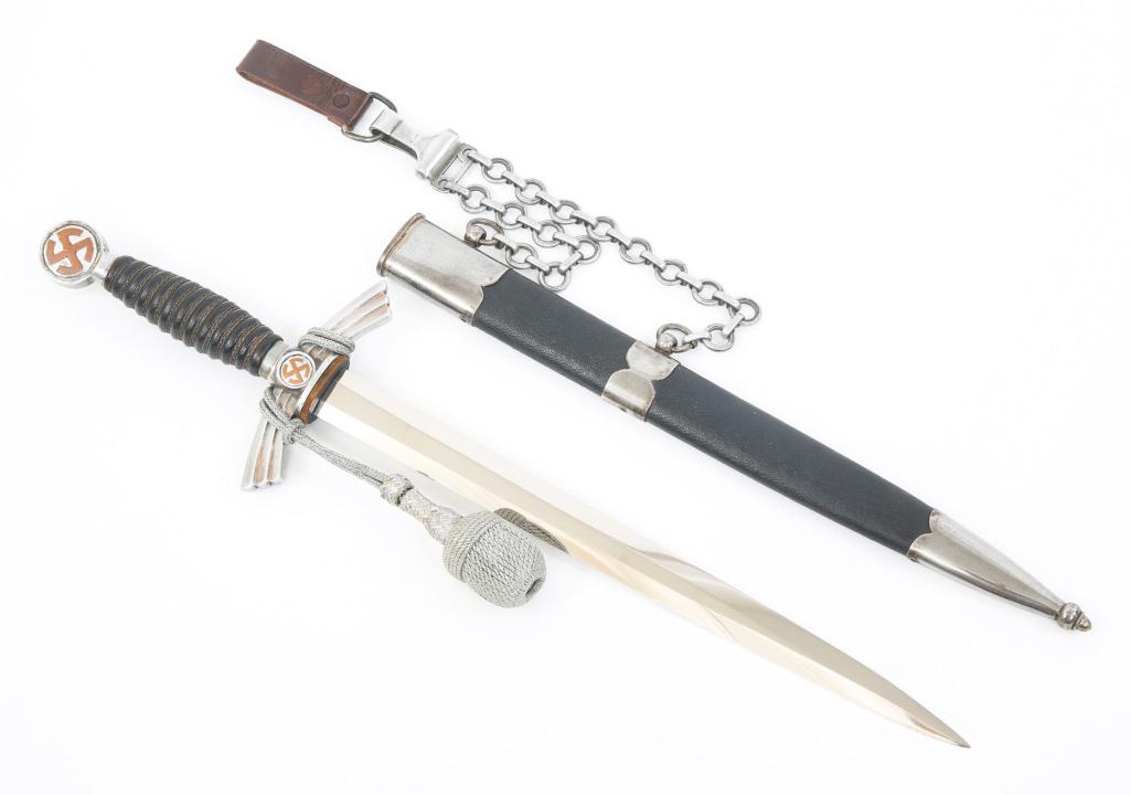 WWII GERMAN LUFTWAFFE 1ST MODEL DAGGER: WWII GERMAN LUFTWAFFE 1ST MODEL DAGGER WWII German Luftwaffe 1st Model Dagger with Scabbard, Chain Hanger & Portepee. Bright blade, by Ernst Pack & Söhne (Siegfried), Solingen maker marked ricasso. L