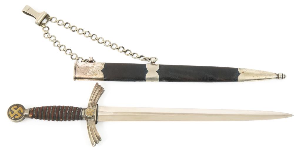 WWII GERMAN LUFTWAFFE FIRST MODEL CHAINED DAGGER: WWII GERMAN LUFTWAFFE FIRST MODEL CHAINED DAGGER Third Reich 1st model WWII Luftwaffe dagger by SMF, as maker marked on ricasso "SMF SOLINGEN" with manufacturer's insignia. Blue Moroccan leather & wir