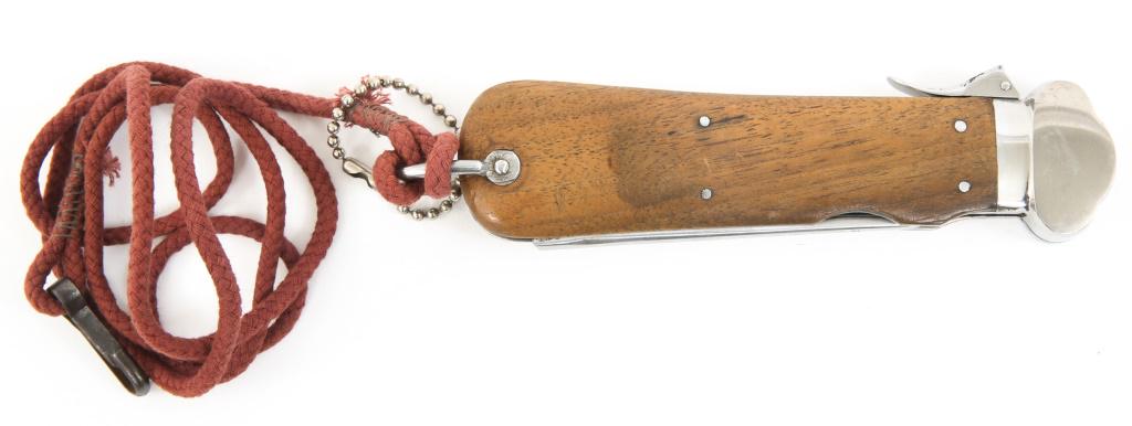 WWII GERMAN PARATROOPER GRAVITY KNIFE WEYERSBERG: WWII GERMAN PARATROOPER GRAVITY KNIFE WEYERSBERG WWII German Paratrooper's (Fallschirmjager) Gravity Knife. Bright blade, visible grain, marked "Paul Weyersberg & Co. Solingen Rostfrei". Wooden grips.