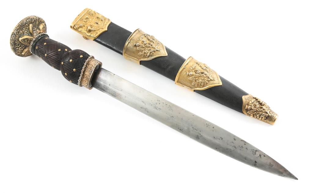 SCOTTISH HIGHLAND THEATER TOURIST KNIFE & SCABBARD: SCOTTISH HIGHLAND THEATER TOURIST KNIFE & SCABBARD Scottish Highland Modern Production Tourist / Theater Knife with Scabbard. Woven pattern carved onto studded black bog wooden handle, with black leat