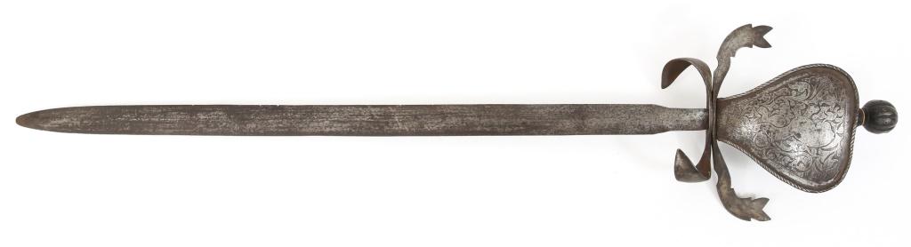 SCOTTISH BROADSWORD RAMPANT LION MARKED: SCOTTISH BROADSWORD RAMPANT LION MARKED Scottish broadsword. Engraved large handguard plaque with the heraldic rampant lion. Curved dual hilt designed to break the opponent's blade in combat. Double e