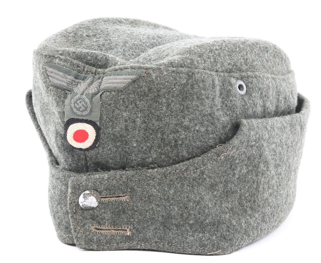 WWII GERMAN ARMY HEER M42 EM/NCO OVERSEAS CAP: WWII GERMAN ARMY HEER M42 EM/NCO OVERSEAS CAP WWII German Army ( Heer ) M42 wool field cap. Maker marked but barely visible. 2 vent holes. Size: 7 US