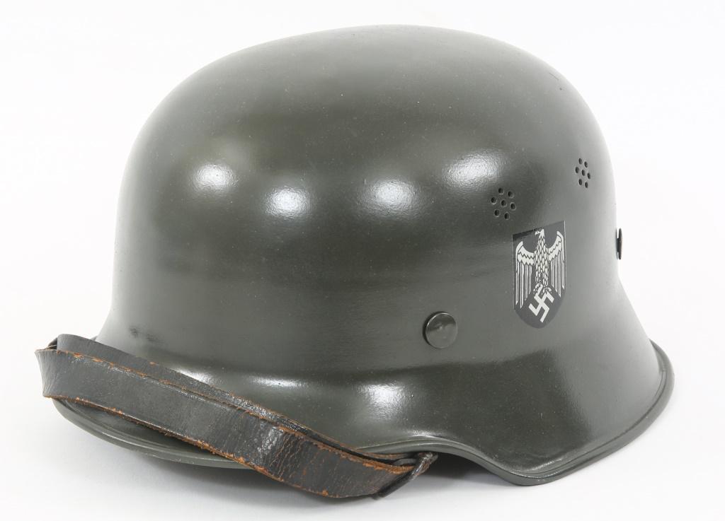 WWII GERMAN M34 CIVIL POLICE DOUBLE DECAL HELMET: WWII GERMAN M34 CIVIL POLICE DOUBLE DECAL HELMET Double decal M34 Civil Police light duty helmet. Black leather chin strap, 9 finger brown leather liner stamped "57" and "Carl Henkel Bielefeid" and se