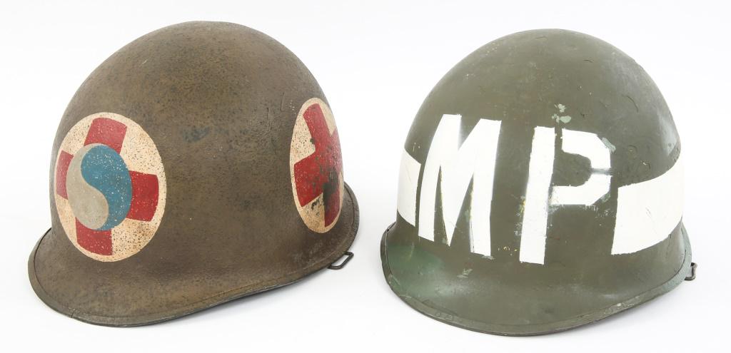 NAMED WWII FRONT SEAM FIXED BALE M1 & MP HELMETS: NAMED WWII FRONT SEAM FIXED BALE M1 & MP HELMETS Lot of 2 Helmets. (1) WWII era Front Seam, swivel Bale McCord shell. The Shell is post War sand painted and marked with the medic red cross and the mon
