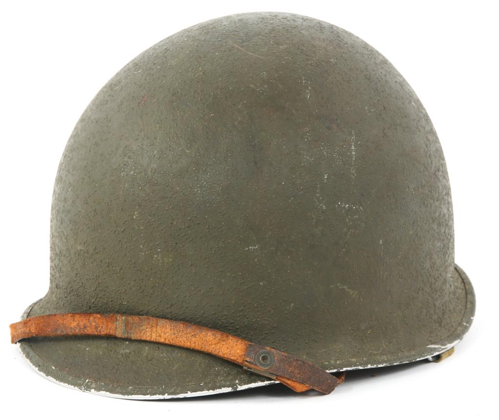 WWII US ARMY M1 COMBAT HELMET WITH MSA LINER: WWII US ARMY M1 COMBAT HELMET WITH MSA LINER WWII US Army M1 Helmet with liner. Front seam, fixed bale. Interior marked "573B" on brim. Liner by MSA. Suspension webbing. Canvas & leather straps.