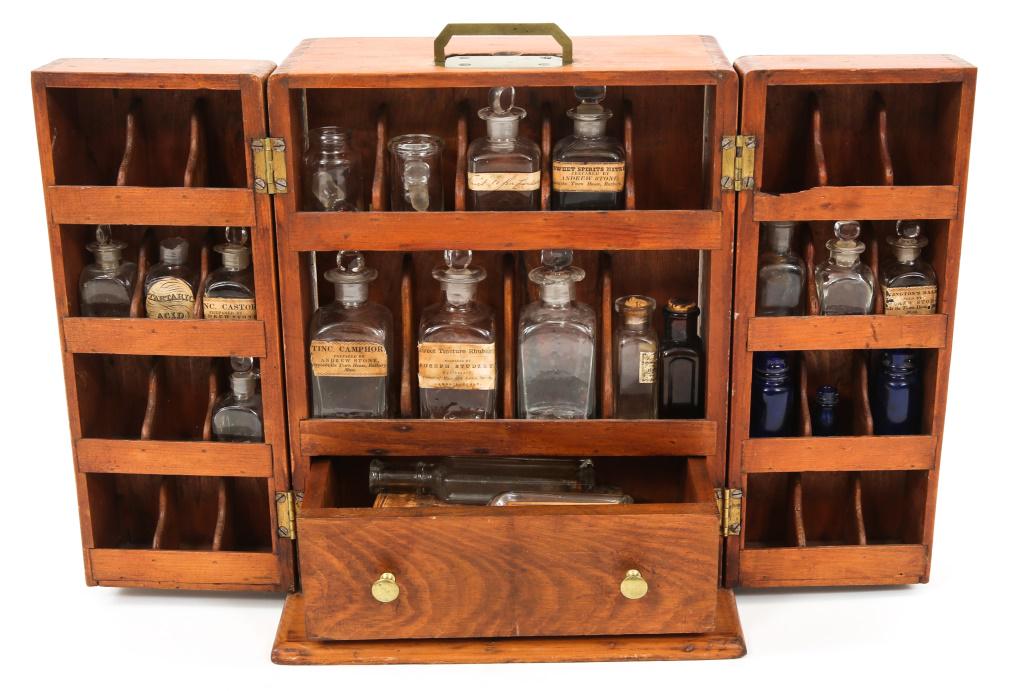 APOTHECARY FIELD MEDICINE CABINET: APOTHECARY FIELD MEDICINE CABINET Apothecary Field Medicine Cabinet. Measures 14" by 11.25" by 7.5". Folding dual door configuration with pull out drawer. Components are period Apothecary glass bottle