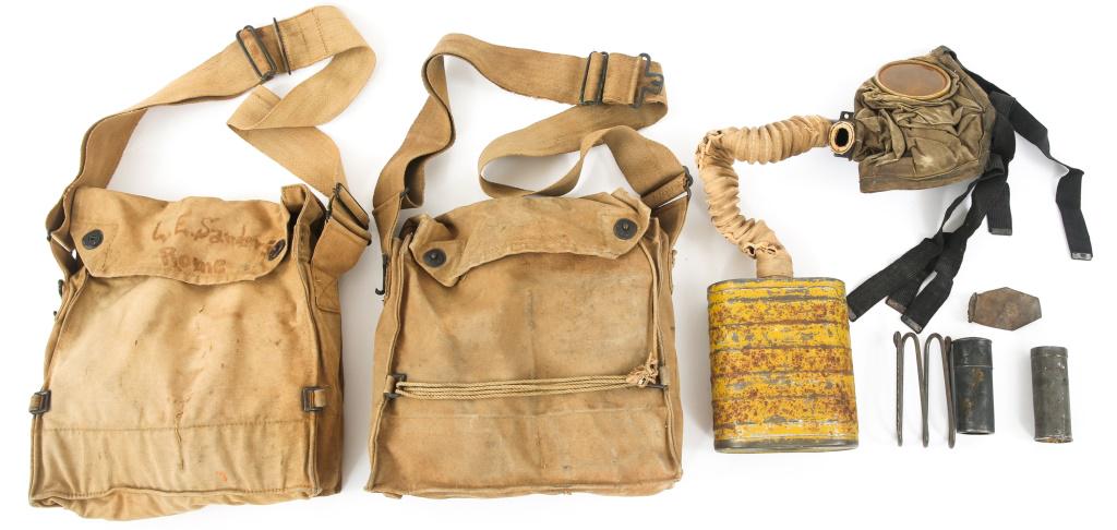 WWI US M1917 NAMED GAS MASKS LOT OF 3: WWI US M1917 NAMED GAS MASKS LOT OF 3 Lot of 3 WWI US Armed Forces M1917 Gas masks. (1) Loose Gas Mask (no case). (1) Cased Gas Mask, Named to "L.E Sanders ROME" as hand marked on flap. (1) Cased Gas 