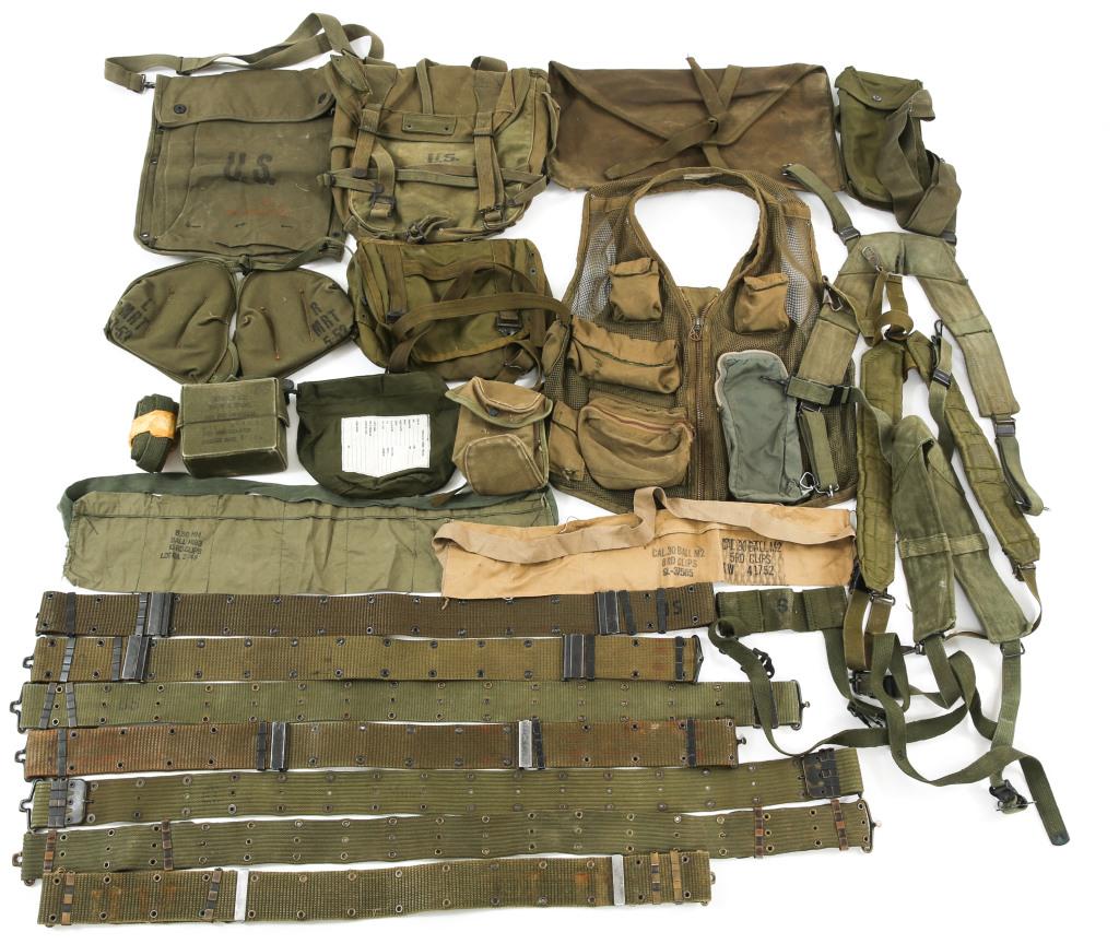 VIETNAM WAR US ARMY COMBAT FIELD GEAR LARGE LOT: VIETNAM WAR US ARMY COMBAT FIELD GEAR LARGE LOT Vietnam War US Army combat field gear large lot, including pouches; bandolier; combat belt; H suspenders; and survival vest.
