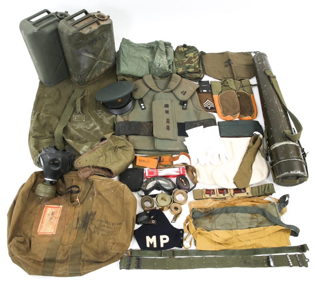 COLD WAR ERA US ARMY MILITARY FIELD GEAR LOT: COLD WAR ERA US ARMY MILITARY FIELD GEAR LOT Lot includes Two Korean War era Gas Cans, Laundry sacks, Gas Mask, Visor, Armor Kevlar Vest, Tripod Case, Webbing, Extreme Cold Weather Boot Liners and muc