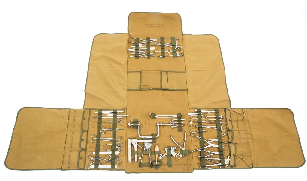 COLD WAR US MEDICAL CORPS NEURO SURGERY KIT LOT: COLD WAR US MEDICAL CORPS NEURO SURGERY KIT LOT Surgical kit marked "Neuro Surgical Brain & Nerve" "WM. W. STANLEY CO. INC." marked on inside of flap, Model 8109 Bone saw motor.