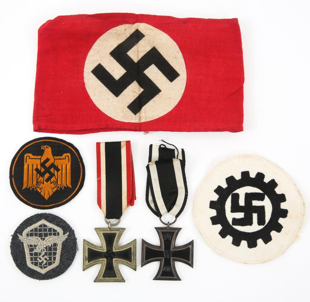 WWI WWII GERMAN IRON CROSS PATCH & ARMBAND LOT: WWI WWII GERMAN IRON CROSS PATCH & ARMBAND LOT Lot of WWI - WWII German Iron Crosses, Patches, and Armband. Includes : WWI Iron Cross 2nd class with ribbon, WWII Iron Cross 2nd class, NSDAP Party Armb