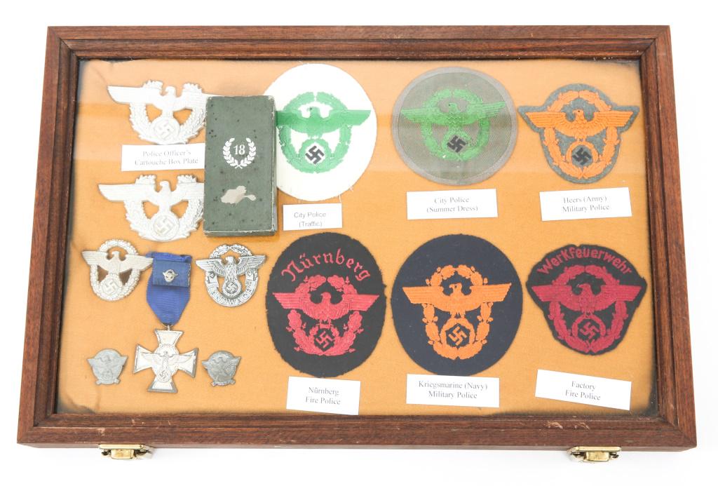 WWII GERMAN POLICE PATCH & INSIGNIA MIXED LOT: WWII GERMAN POLICE PATCH & INSIGNIA MIXED LOT WWII German Police patch, insignia and medal mixed lot. Includes 2 display showcases 18" x 12".