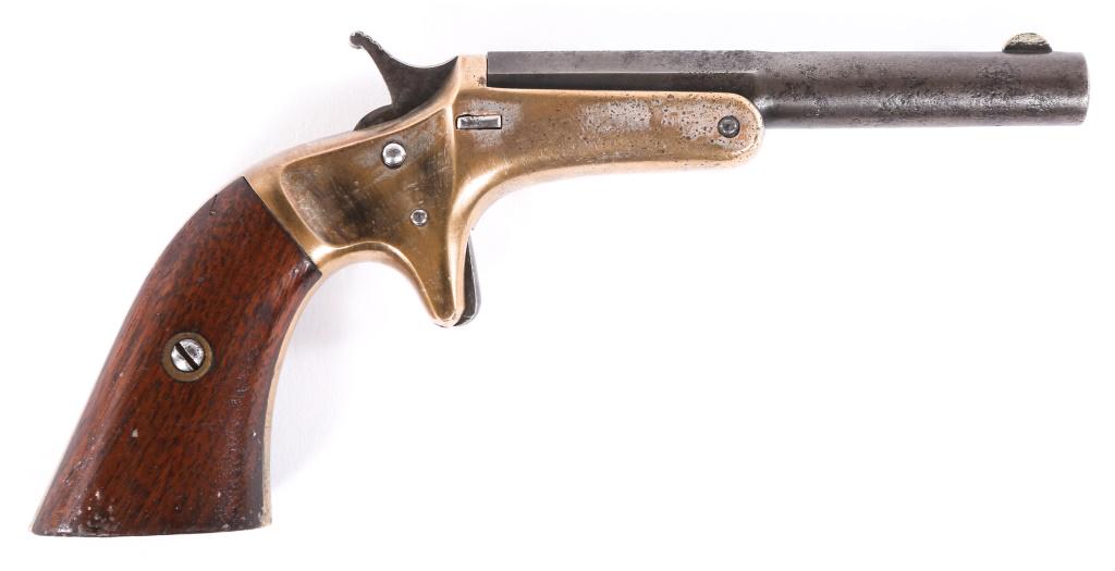 J. STEVENS M1864 .22 CAL TIP-UP POCKET PISTOL: J. STEVENS M1864 .22 CAL TIP-UP POCKET PISTOL J. Stevens model 1864 .22 caliber Tip-Up Pocket pistol. Blued barrel, brass frame, spur trigger, walnut grips, and matching serial numbers on barrel and t