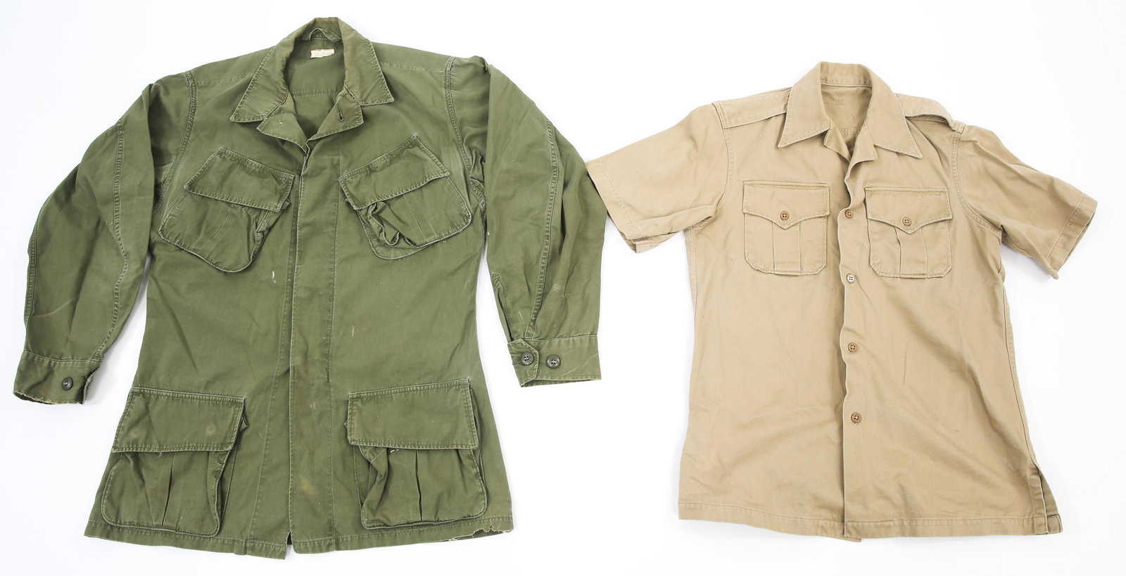US ARMY COLD WAR OG107 COAT & KHAKI SHIRT LOT: US ARMY COLD WAR OG107 COAT & KHAKI SHIRT LOT Cold War Utility Uniform Shirts Lot. (1) OG107 Olive Green Army Shade 107 Cotton Wind Resistant Coat. Size: Small - Long. (1) Tan / Khaki Short Sleeve Shi