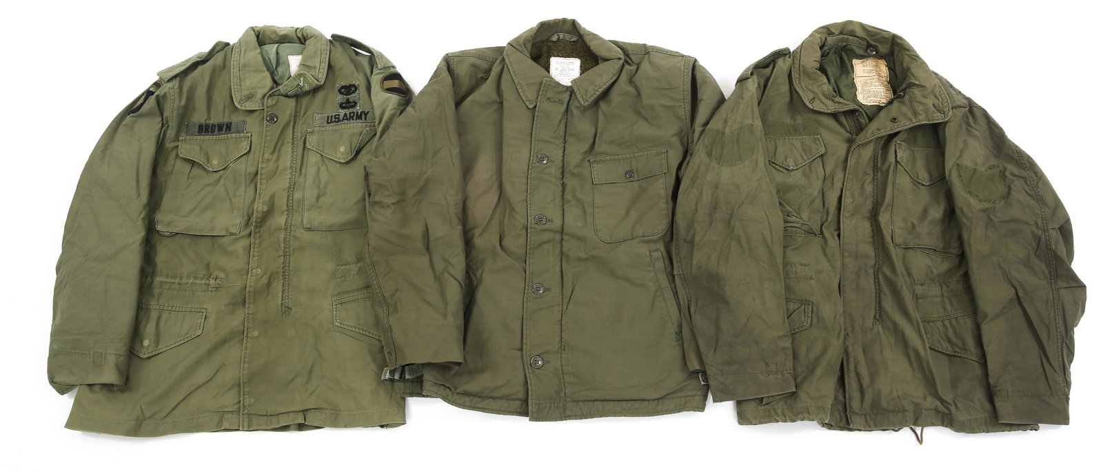 US ARMY COLD WEATHER FIELD JACKET LOT OF 3: US ARMY COLD WEATHER FIELD JACKET LOT OF 3 US Army cold weather field jacket, lot of 3. (1) Vietnam War 101st Airborne combat medic M65 field jacket, size small. (1) Post Nam, dated 79 US Army M65 fie