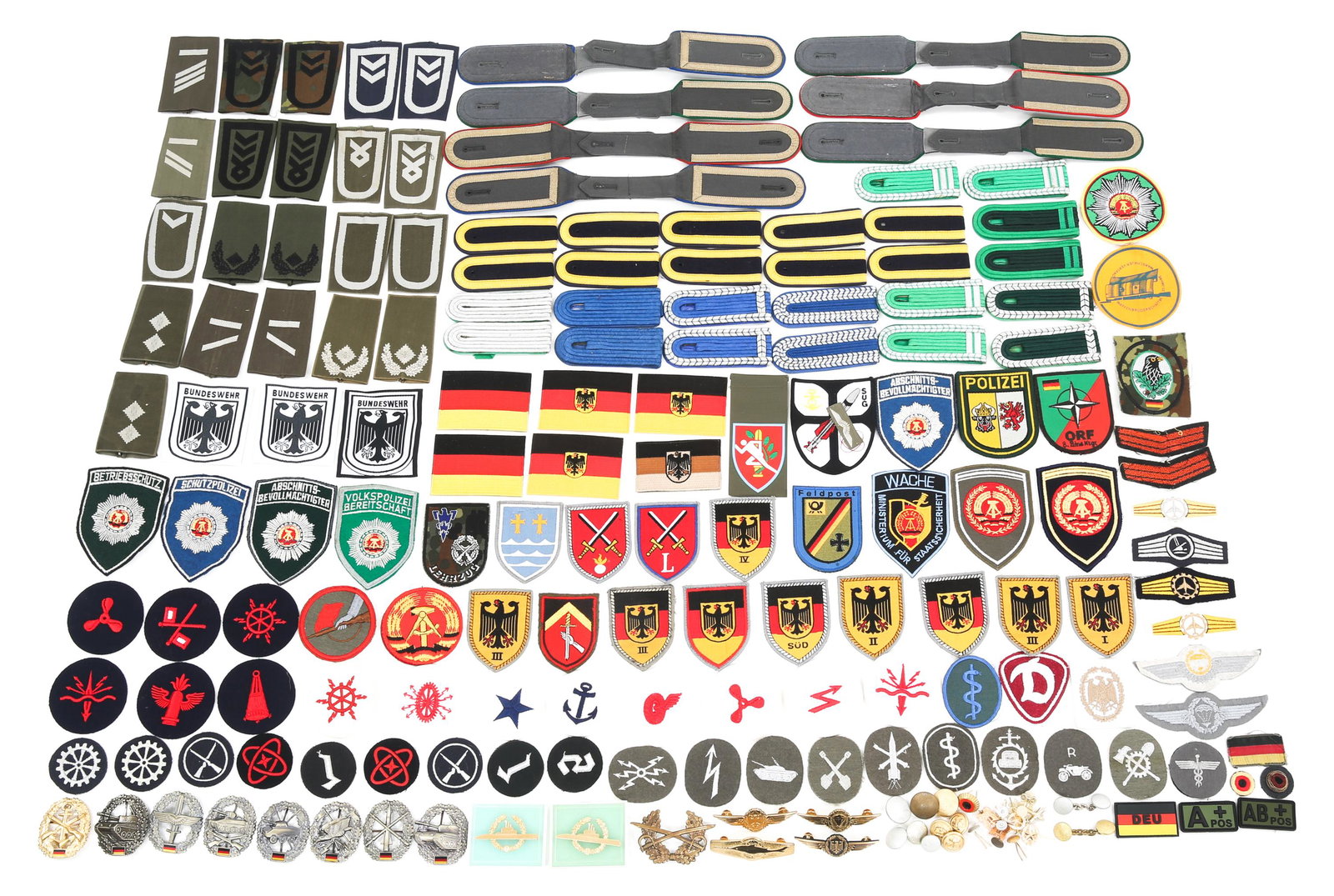 POST WWII WEST GERMAN INSIGNIA MEDAL & PATCHES LOT: POST WWII WEST GERMAN INSIGNIA MEDAL & PATCHES LOT Post WWII West German insignia, medals and patches lot. Various rank insignia shoulder boards, sleeve patches, hat badges, breast badges, pins, medal