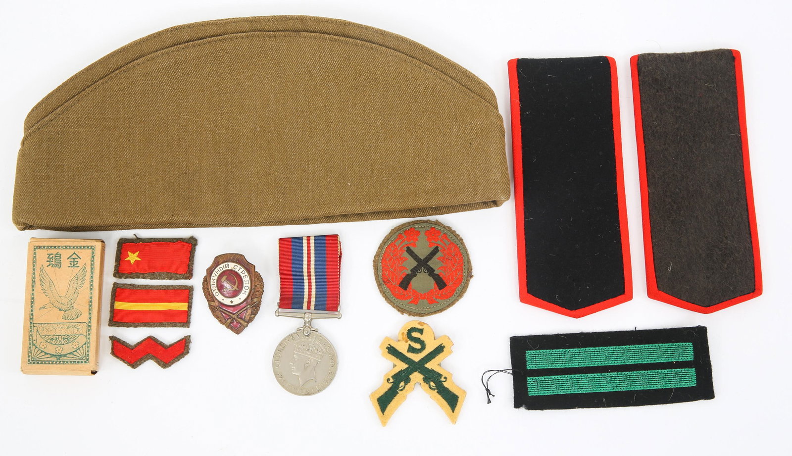 WWII UK SOVIET & JAPANESE MILITARY ITEMS LOT: WWII UK SOVIET & JAPANESE MILITARY ITEMS LOT Lot of WWII to Cold War World Military Uniforms Cap, Medals, Badges, Patches and Other Items. Include: WWII Japanese Cigarette packet, Soviet Overseas cap 