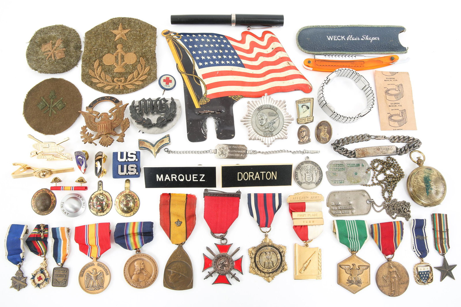 WWII TO COLD WAR US ARMY DOG TAGS & MEDALS LOT: WWII TO COLD WAR US ARMY DOG TAGS & MEDALS LOT Cold War era US Army dog tags medals and insignia lot. US marked brass compass. Two US dog tags. Bracelet with name, rank and service number. Signal corp