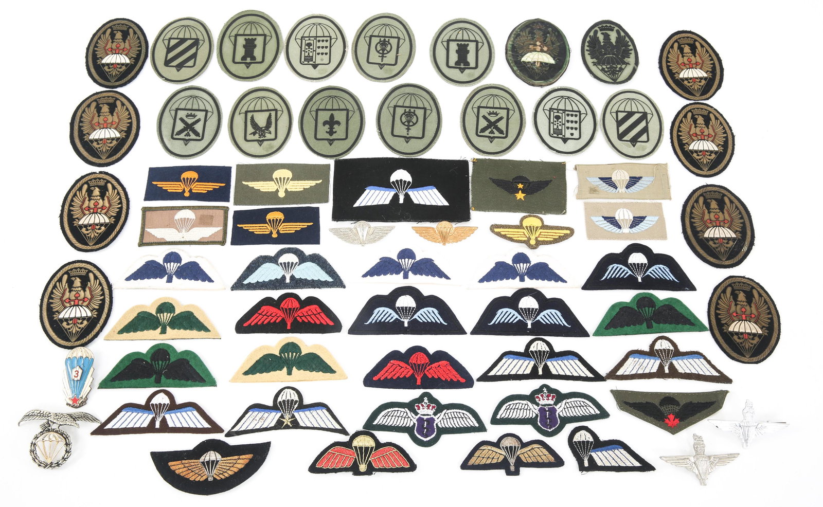 WORLD MILITARY PARATROOPER QUALIFICATION WINGS LOT: WORLD MILITARY PARATROOPER QUALIFICATION WINGS LOT World Military paratrooper qualification jump wing patches, badges & pins lot. Spain, Netherlands, Switzerland and more. Fabric patches, and metallic