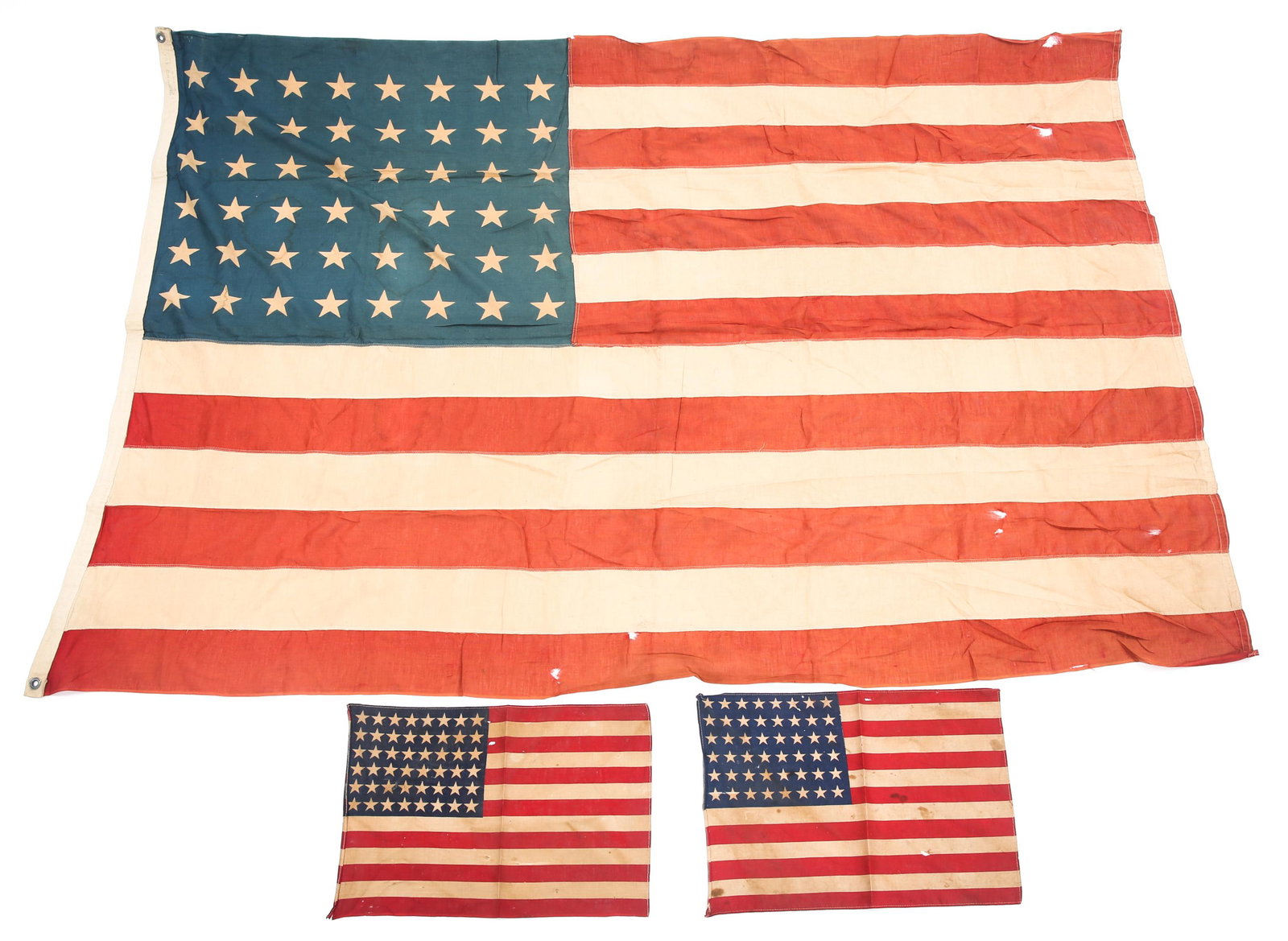 WWII US NATIONAL 48-STAR FLAGS LOT OF 3: WWII US NATIONAL 48-STAR FLAGS LOT OF 3 WWII United States national 48-star flags. (1) Measures 67" by 45" . (2) Two smaller flags that measure 16" by 11".