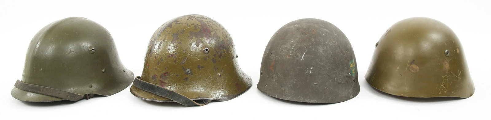 WORLD MILITARY COMBAT HELMET LOT OF 4: WORLD MILITARY COMBAT HELMET LOT OF 4 World Military combat helmet, lot of 4. (1) Swedish Model 37/65 double decals helmet. (2) WWII Bulgarian Army M36 combat helmets. (1) Bulgaria M51 helmet.