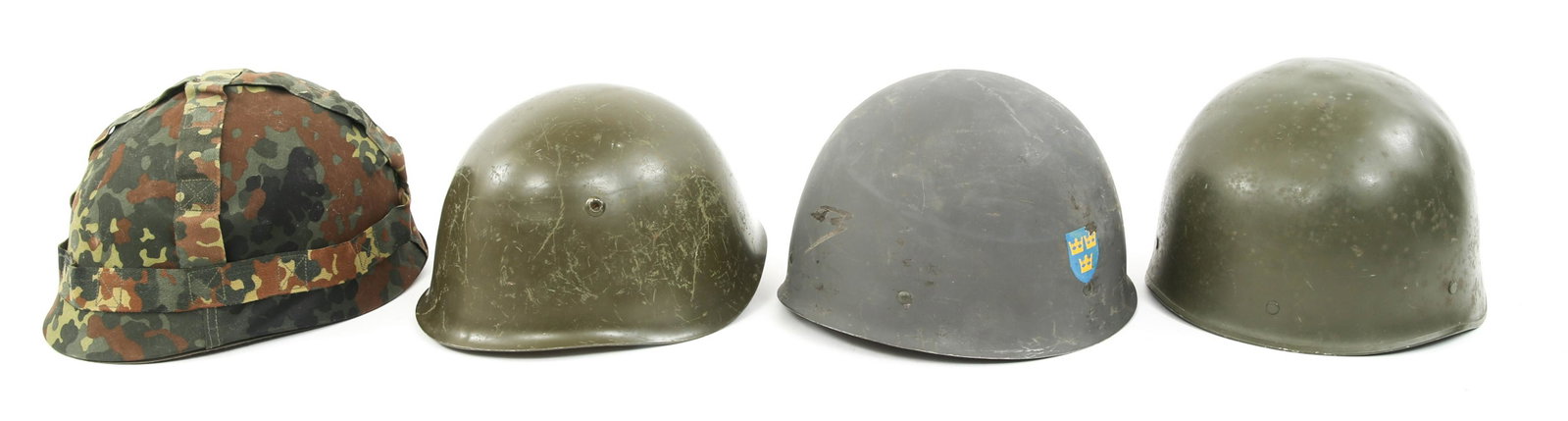 WORLD MILITARY COMBAT HELMET LOT OF 4: WORLD MILITARY COMBAT HELMET LOT OF 4 World Military combat helmet, lot of 4. (1) Swedish Model 37/65 double decals. (1) Bulgaria M51/72. (1) West German M71Airborne Jump helmet. (1) Belgium M71 Airbo