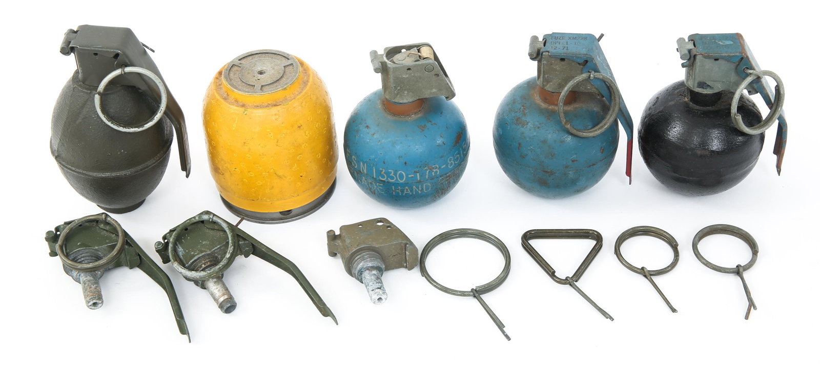 VIETNAM WAR ERA US & WORLD ORDNANCE GRENADES LOT: VIETNAM WAR ERA US & WORLD ORDNANCE GRENADES LOT Vietnam war era US & world ordnance inert grenades lot. Yellow painted ordnance component. Two blue painted training US M67 / M69 Vietnam era grenades,