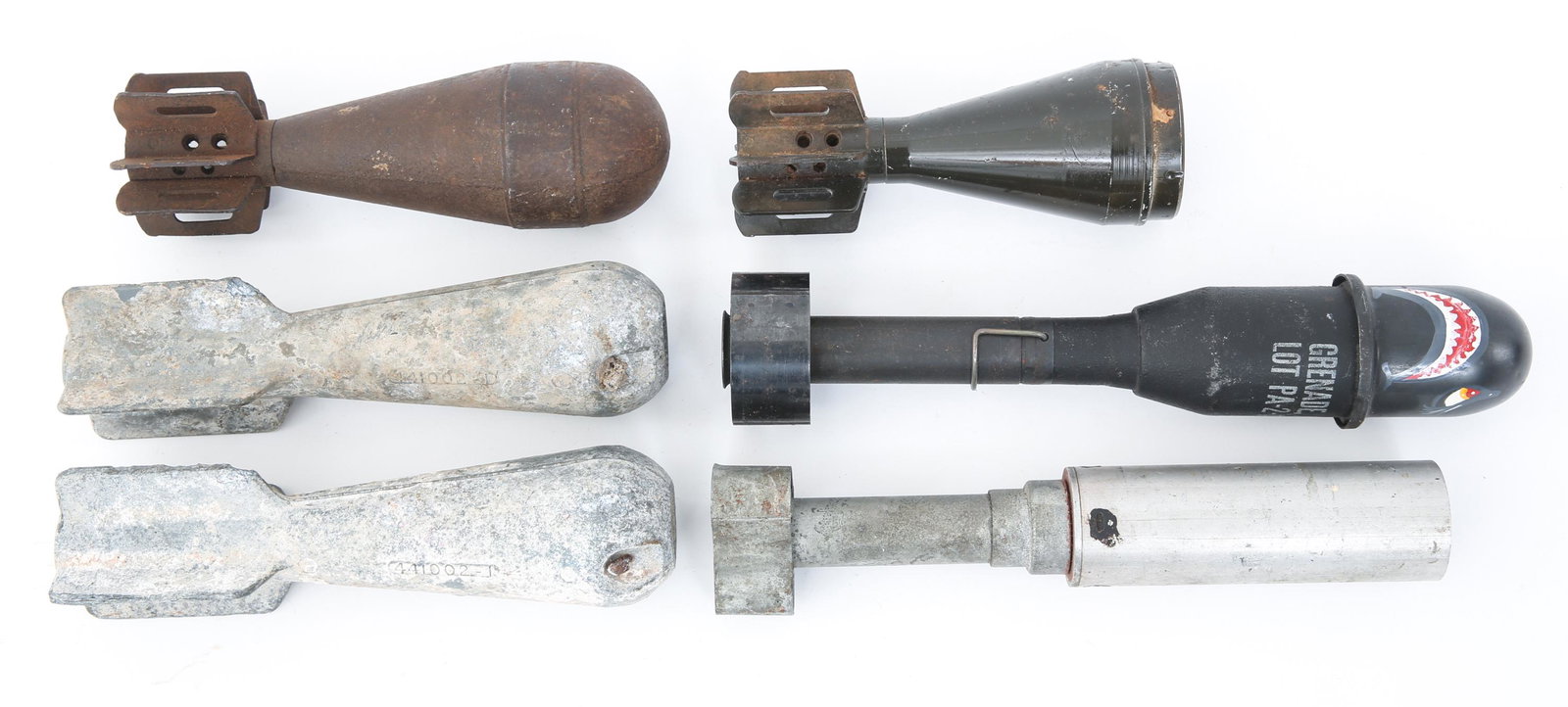US MILITARY PRACTICE ORDNANCE & MORTARS LOT OF 6: US MILITARY PRACTICE ORDNANCE & MORTARS LOT OF 6 US Military Cold War era practice ordnance & mortars lot of 6. One is marked "Grenade A.T., Practice M11A3", below hand painted face, one shell has its