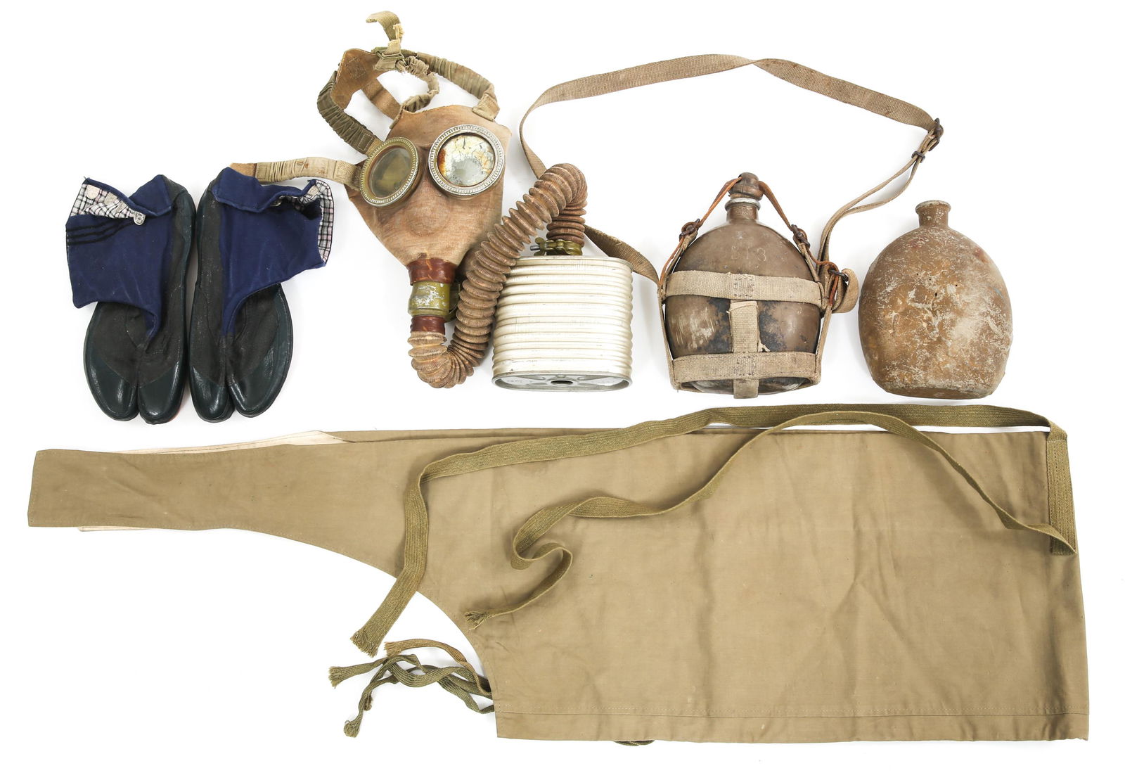 WWII IMPERIAL JAPANESE FIELD GEAR LOT: WWII IMPERIAL JAPANESE FIELD GEAR LOT WWII Imperial Japanese Field Gear Lot. Includes: Gas mask with hose & respirator, Army tube pack, two canteens (one with cap & hanging strap), pair of coral boots