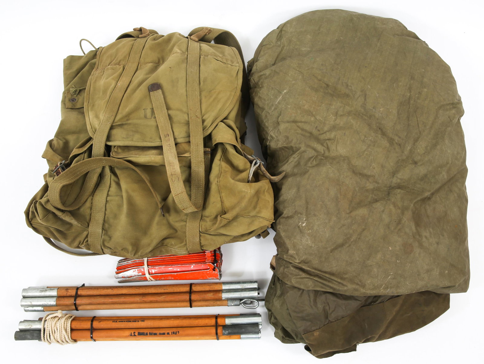 WWII US MOUNTAIN TROOPS REVERSIBLE TENT & BACKPACK: WWII US MOUNTAIN TROOPS REVERSIBLE TENT & BACKPACK WWII US Army Mountain Troops lot. Includes; 1- Mountain Troops single opening reversible ( white - OD green ) tent with poles and pegs, dated 1943; 1