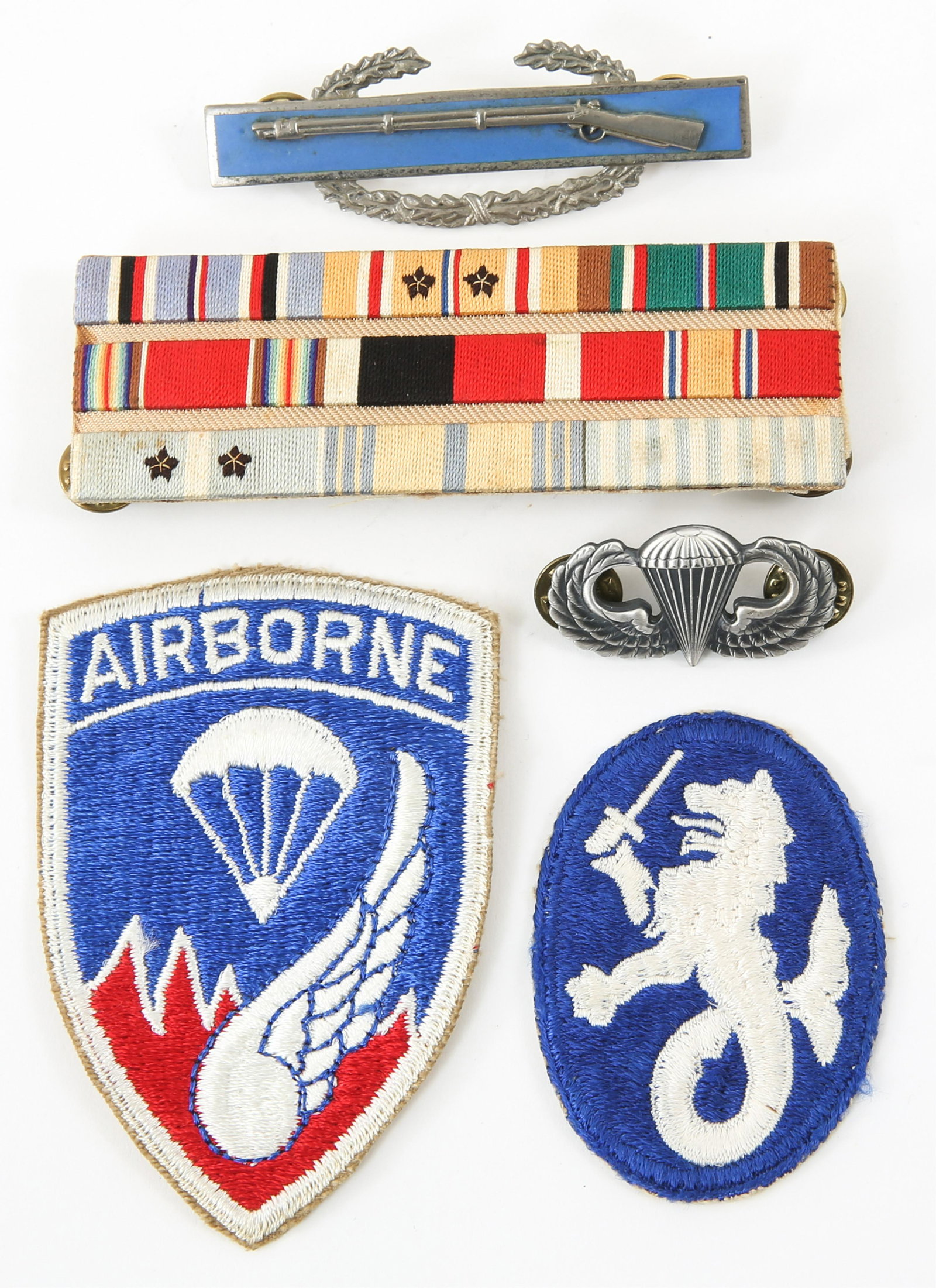 WWII - KOREA US ARMY AIRBORNE PATCH & INSIGNIA LOT: WWII - KOREA US ARMY AIRBORNE PATCH & INSIGNIA LOT 1- Custom made embroidered ribbon bar. 1- Full size Combat Infantry badge by NS Meyer. 1- Air borne Jump wings stamped G23. 2- Patches.