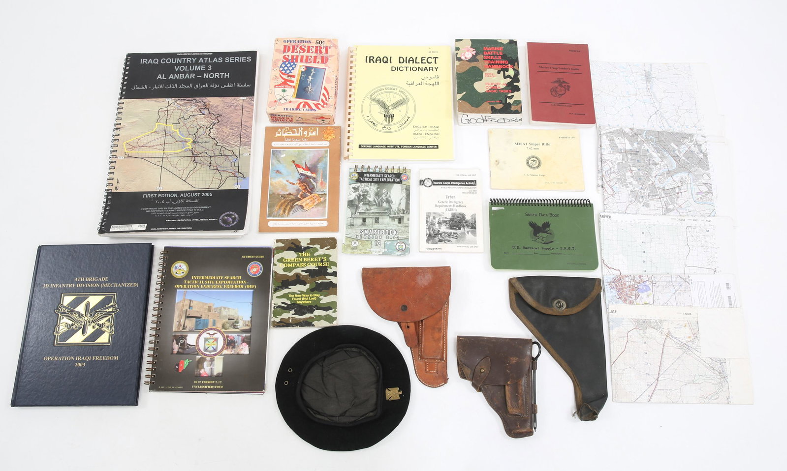 IRAQI FREEDOM US ARMY TACTICAL MAPS & BRING BACK: IRAQI FREEDOM US ARMY TACTICAL MAPS & BRING BACK Operation Iraqi Freedom, US Army maps, tactical books and bring back items. Includes; (3) Iraqi Army pistol holsters. (1) Iraqi Guard Officer beret. (1