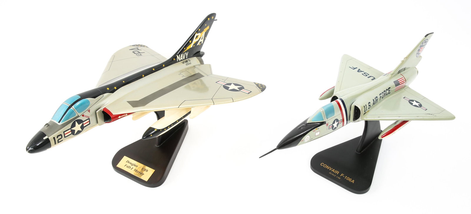 USAF F4D-1 & US NAVY F-106A MODEL JETS LOT OF 2: USAF F4D-1 & US NAVY F-106A MODEL JETS LOT OF 2 USAF & USN 1/48 scale model jets lot of 2. (1) Douglas USN F4D Skyray, measures 18" by 13". Accompanied by plastic base. (1) USAF Convair F-106A measure