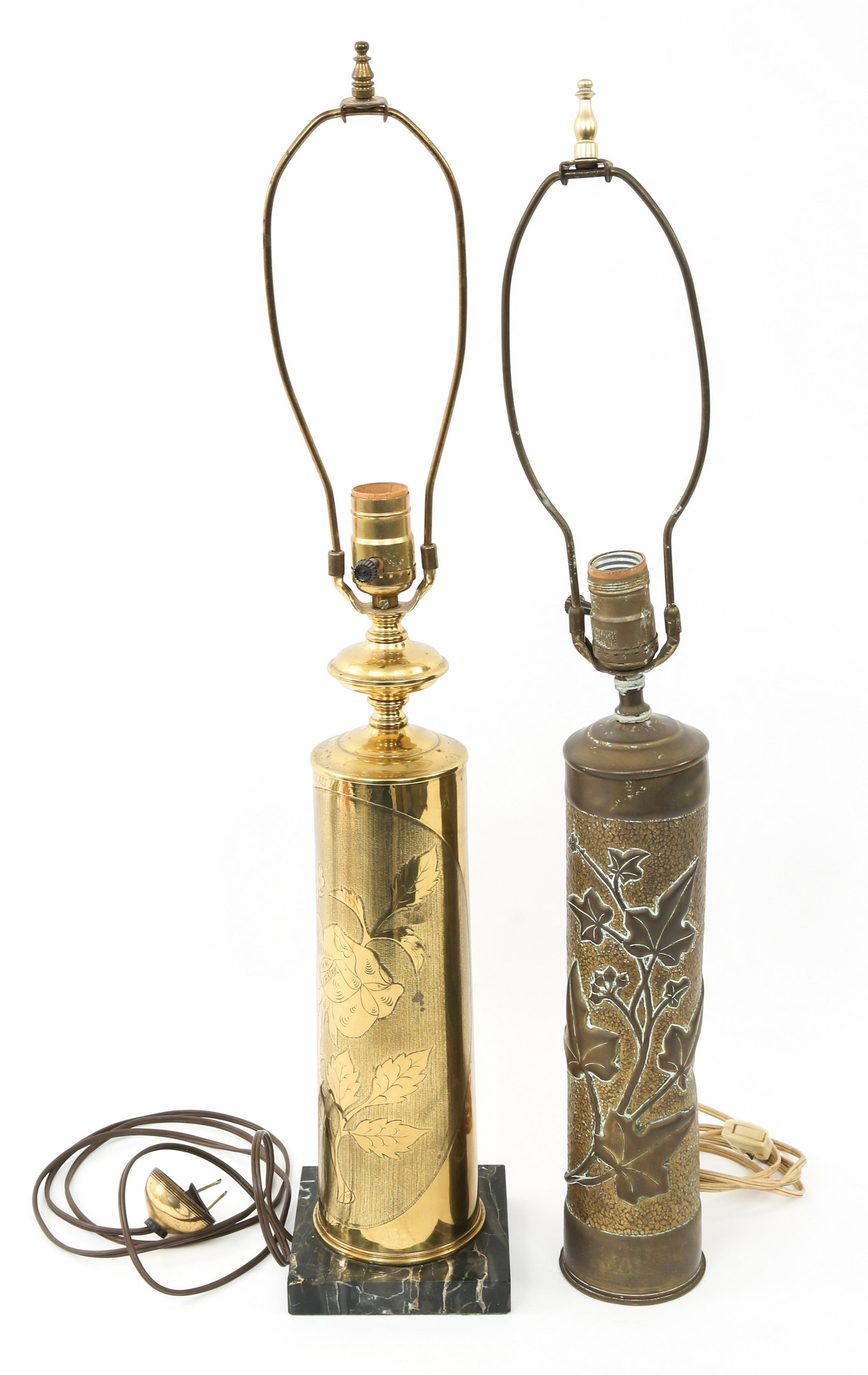 WWI TRENCH ART ARTILLERY SHELL LAMPS LOT OF 2: WWI TRENCH ART ARTILLERY SHELL LAMPS LOT OF 2 WWI trench artillery shell lamps lot of 2. (1) Shell for the French Canon de 75 modèle 1897. Head stamped "75", floral designs decorate the exterior. (1)