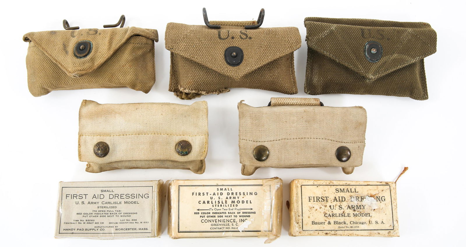 WWI & WWII US ARMY FIRST AID & FIELD DRESSING LOT: WWI & WWII US ARMY FIRST AID & FIELD DRESSING LOT WWI & WWII US Army first aid kits and field dressing lot. (1) One First Aid Packet dated 1916 in khaki canvas pouch marked "JPS 1917". (1) One Individ