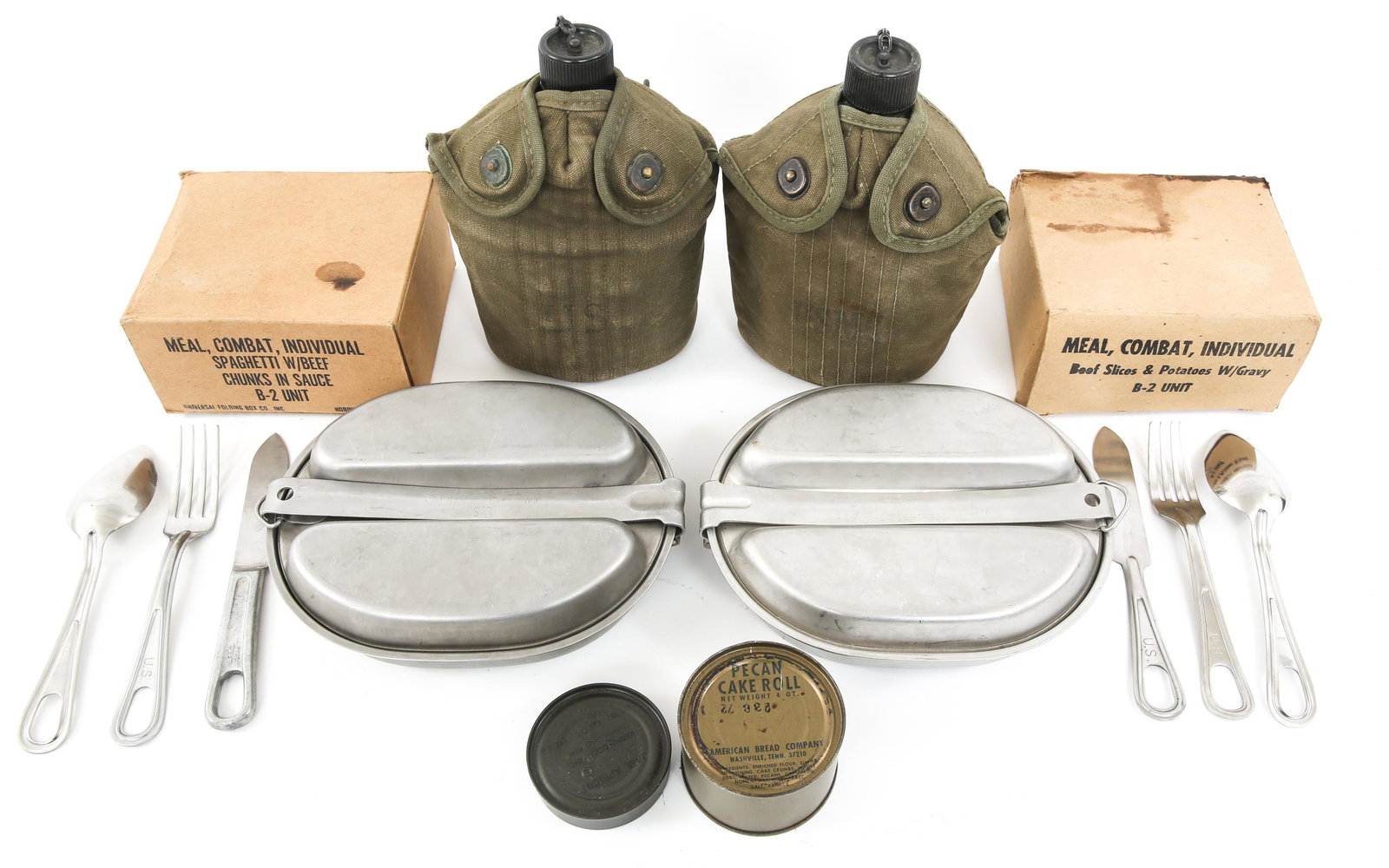 VIETNAM WAR US ARMY C-RATION & FIELD GEAR LOT: VIETNAM WAR US ARMY C-RATION & FIELD GEAR LOT Vietnam War era US Army C-Ration and field gear lot. (2) C-Ration B-2 Unit with content. (2) early complete canteen sets. (2) Mess kit with silverware, da