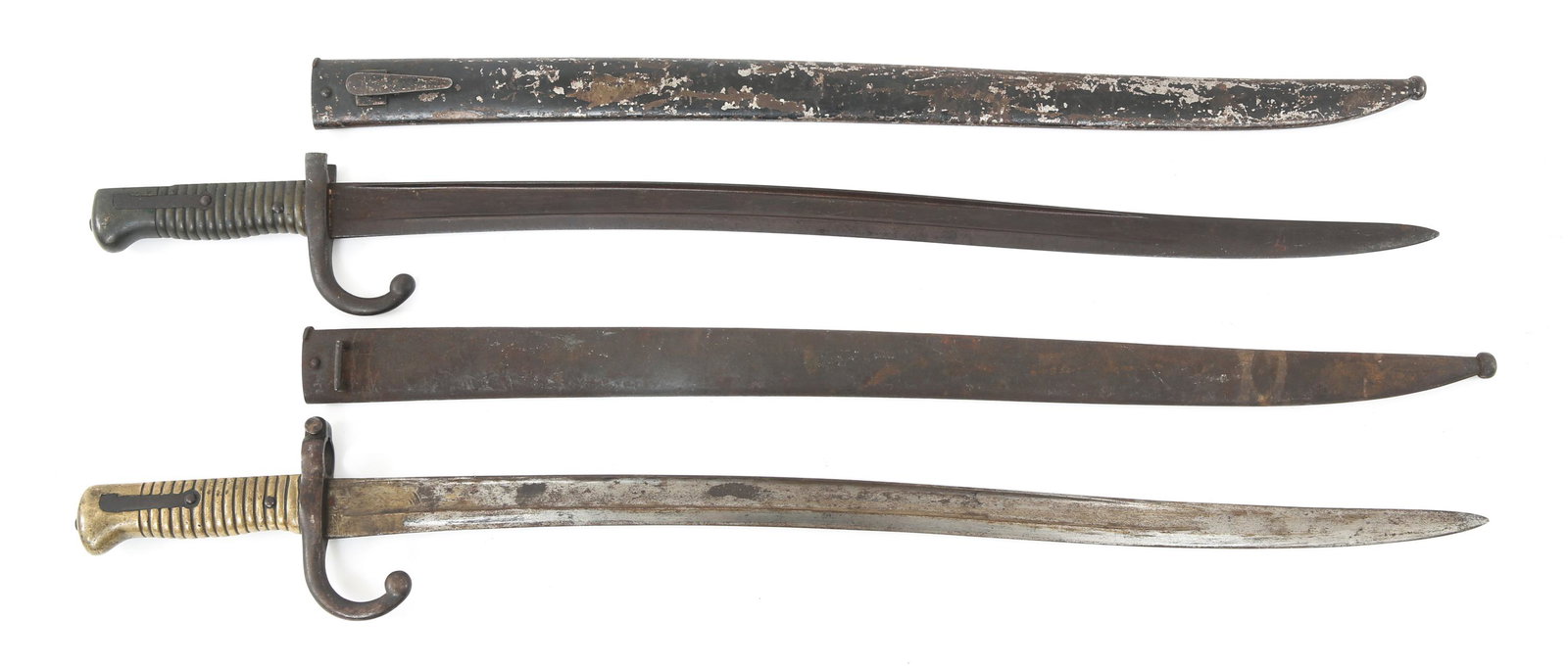 FRENCH M1866 CHASSEPOT YATAGHAN SWORD BAYONETS LOT: FRENCH M1866 CHASSEPOT YATAGHAN SWORD BAYONETS LOT French M1866 Chassepot 'Yataghan' Sword Bayonets Lot of 2. (1) Ricasso bears faintly visible hallmarks. Crossguard marked "V23745", hallmarked at qui