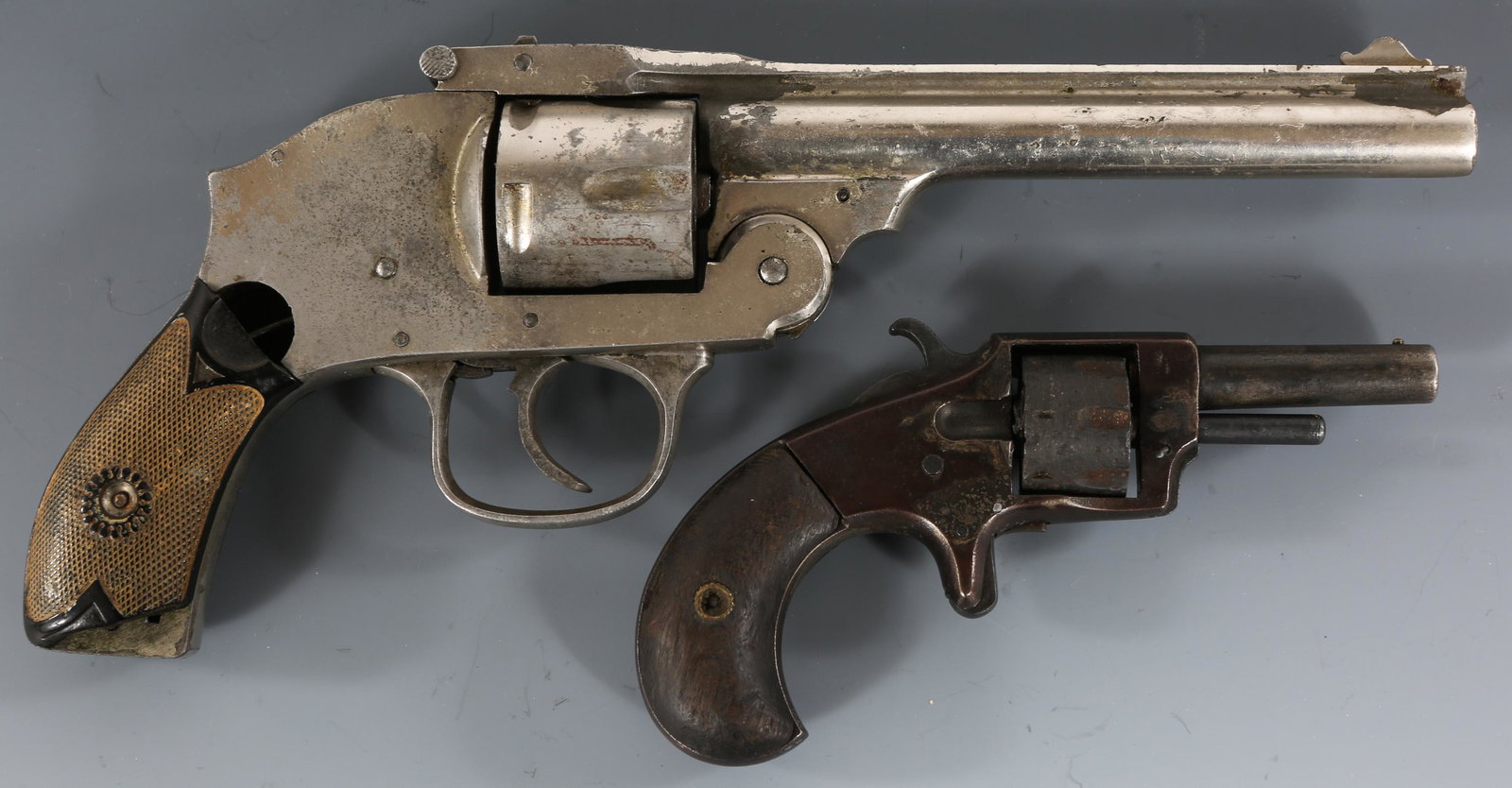 IVER JOHNSON & HOWARD .22 CAL & .38 CAL REVOLVERS: IVER JOHNSON & HOWARD .22 CAL & .38 CAL REVOLVERS Lot of two top-break revolvers, one .22 caliber and one .38 caliber. Iver Johnson Tycoon .22 short, 7 shot revolver. Wood grips. Howard Arms Co. .38 c